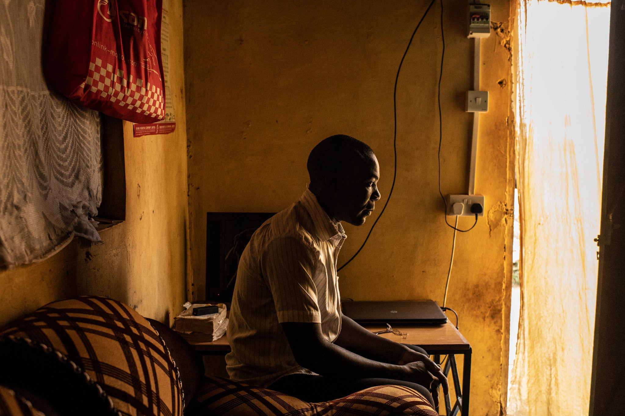 Richard Ochieng’, 26, at his home in Nairobi, Kenya. His Chinese boss called him and other Kenyans monkeys.